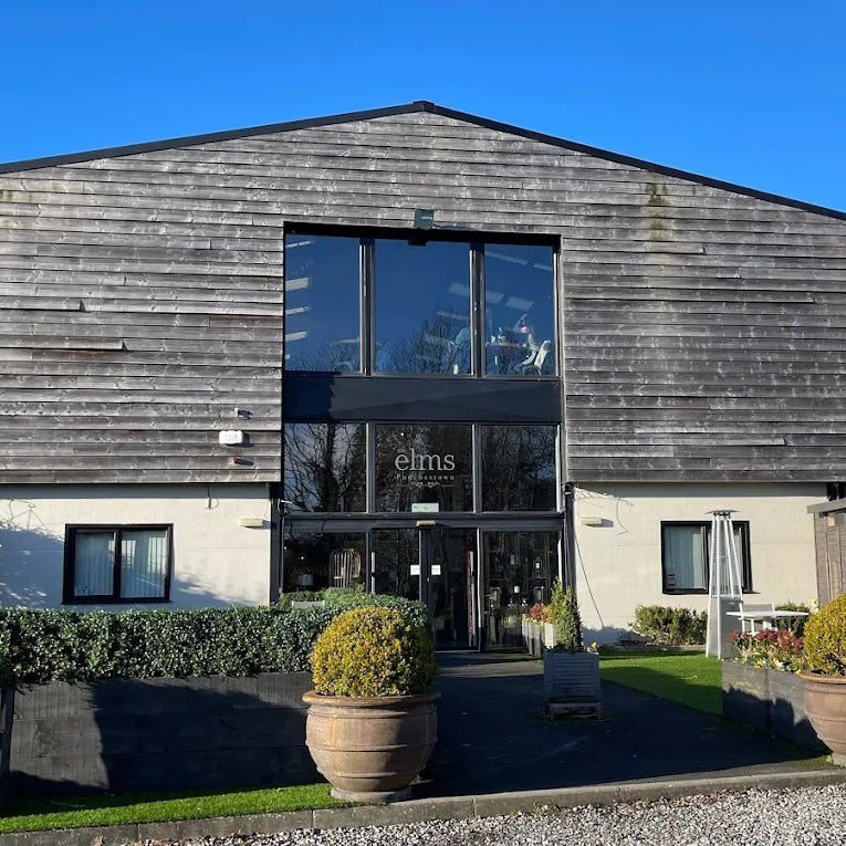 Modern building with wooden facade and glass windows on a clear day